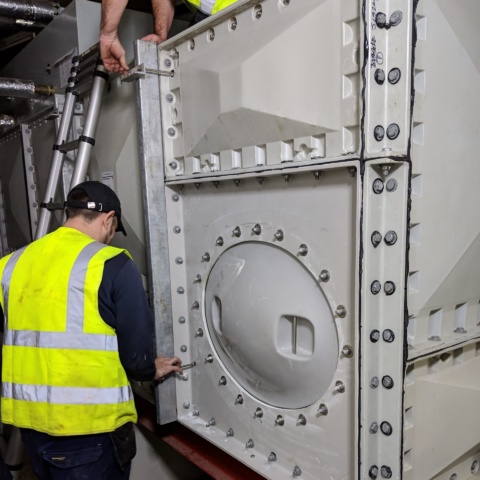 low level manway on water tank to improve safe access